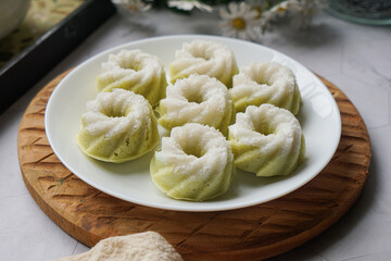 Kuih Puteri Ayu, a popular traditional Malaysian steamed sponge pandan coconut cake.