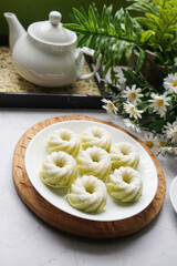 Kuih Puteri Ayu, a popular traditional Malaysian steamed sponge pandan coconut cake.