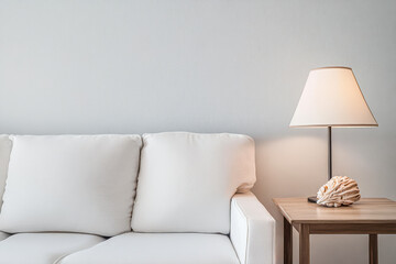 Cozy living room with stylish white sofa and modern lamp by the side table