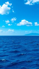 Fototapeta premium Serene Ocean View Under Blue Sky With Clouds