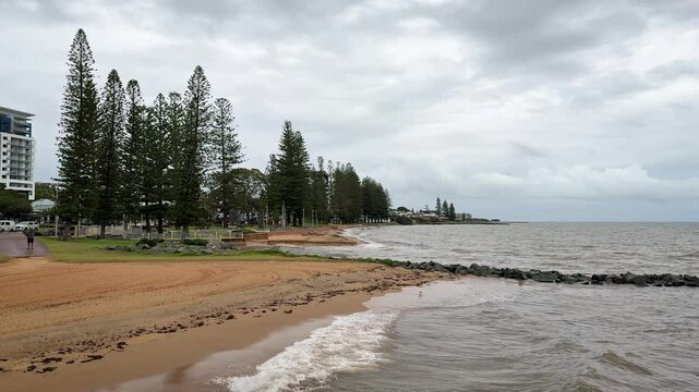 View of the beach from Redcliffe Jetty on an overcast, cloudy day, Queensland, Australia