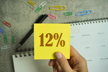 Planning tax 2025 new year symbol. Concept words Tax 2025. Businessmen hand.