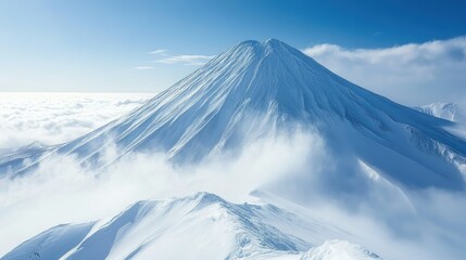 Majestic snow-capped volcano peak rises above a sea of clouds under a clear blue sky.