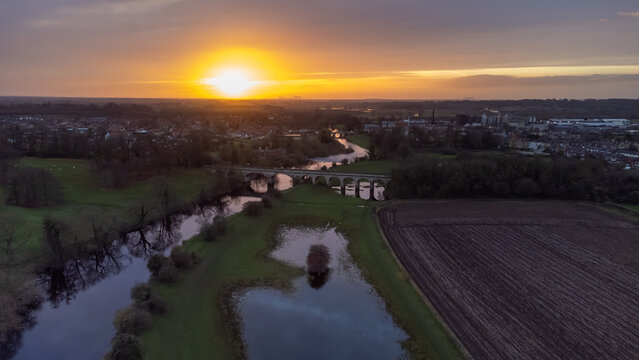 Aerial view of sunrise over flood plain of River Wharfe and town of Tadcaster