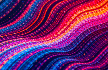 Bright wavy patterns in various colors create a mesmerizing effect, captivating viewers at a nighttime art event