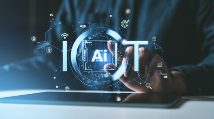 Futuristic IoT concept with AI hologram and human interaction on digital tablet in technology-themed background.