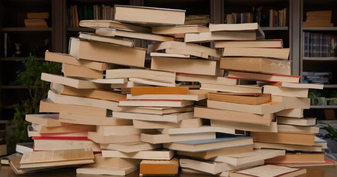 Books Pile Build Stop Motion Loop in Study Medium
