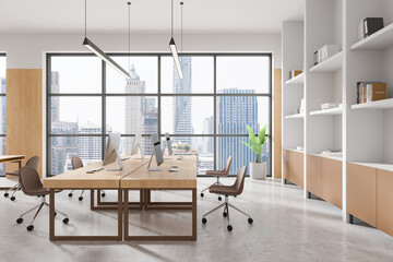 Modern open space office interior with wooden furniture and large windows overlooking a cityscape. 3D Rendering