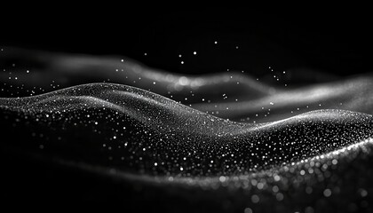 Abstract grayscale image of shimmering particles forming waves