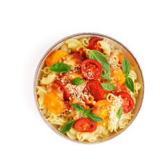 Bowl of tasty pasta with tomato and basil on white background