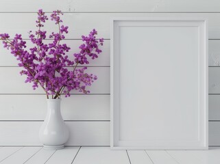 Fototapeta premium White frame mockup with purple flowers in a vase against a white wood wall