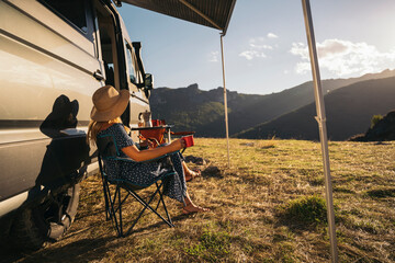 Van life adventure in beautiful mountain landscape, enjoying peace and beauty of nature
