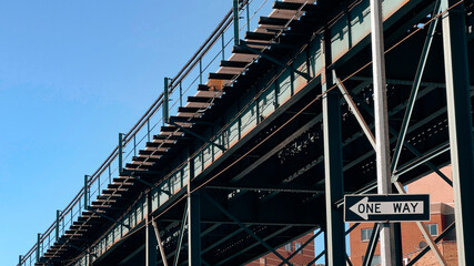 A metal bridge structure with stairs and a 