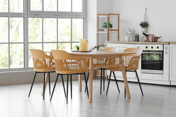 Dining table with candles in kitchen