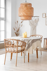 Candles on round table in modern dining room
