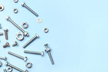 Tap bolts with chrome nuts and washers on blue background