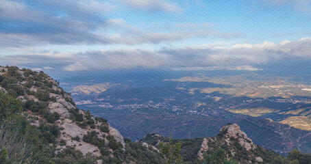 Fototapeta premium Mountain top with a city in the distance
