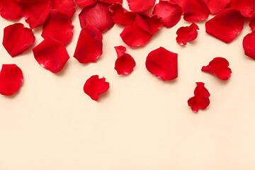 Beautiful red rose petals on beige background