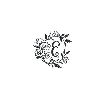 Letter E with graphic leaves, botanic branch bouquet composition. Handdrawn monogram.