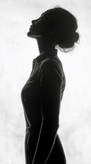 Silhouette of a woman in profile gazing upward against a textured light background