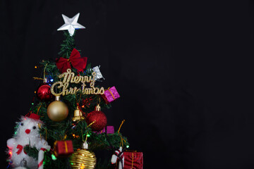 merry christmas tree decoration black background