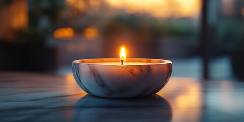 Warm candlelight illuminates a serene moment during golden hour in a cozy setting