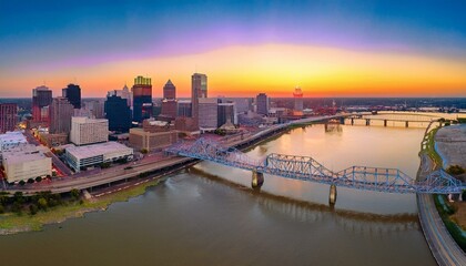 "Louisville at Dawn: A Breathtaking Aerial Perspective of the City and Bridge"