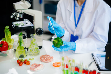 Food scientists in lab coats, testing samples, and analyzing food safety and quality