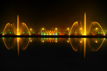 Reflection of the night light show on the water.