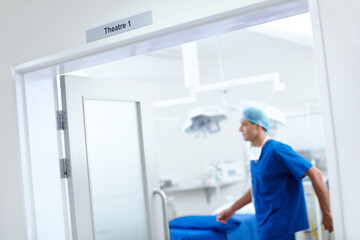Fototapeta premium Doctor, surgery and theatre with man in hospital for healthcare, operating room and emergency. Medical, organ transplant and anatomy with person in clinic for diagnosis, procedure and wellness