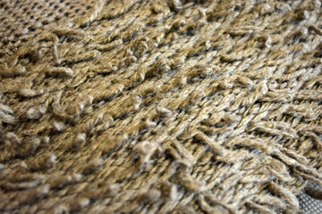 Women's clothing, stylish knitwear made of natural woolen dense threads. Beautiful patterns, braids, nice, soft braided woolen fabric.
