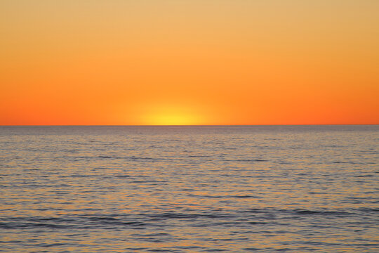 Sunset at the sea with orange sky, background (Jurien Bay, Australia) - Powered by Adobe