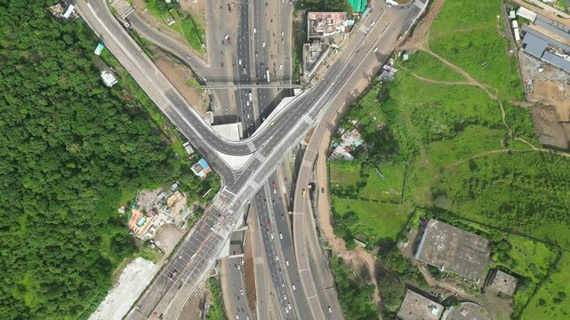 Aerial view of Indian capital and metropolitan city roads of chandani chowk pune, India. Drone shot of highway of India. Roads of developing India., India. 4K