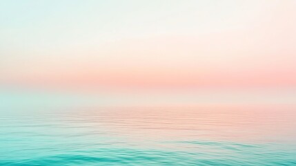 Fototapeta premium A soft, pastel sunset over a calm sea.
