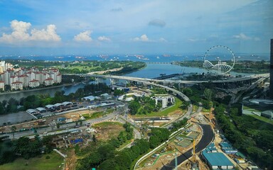 Panoramic Cityscape with Iconic Ferris Wheel and Coastal Harbor, Singapore