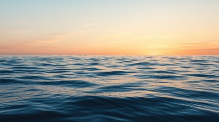 Fototapeta premium Calm ocean waves reflecting a stunning sunset: serene renewable energy concept