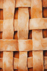 Close-Up of Golden Brown Woven Pie Crust with Textured Surface