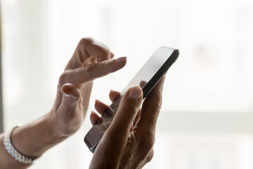 Close up view unknown female hands using modern smartphone, copy space background. Woman holding cellphone, making call or order, websurfing information, download new mobile app for fun or business
