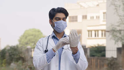 Indian Doctor Wearing Surgical Gloves