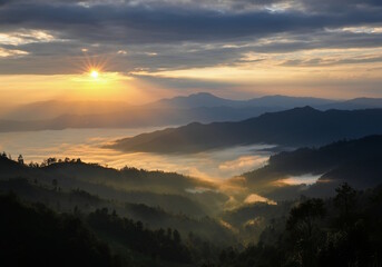 Obraz premium A breathtaking sunrise over misty mountains.