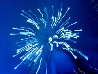Abstract blue light streaks against a dark blue background