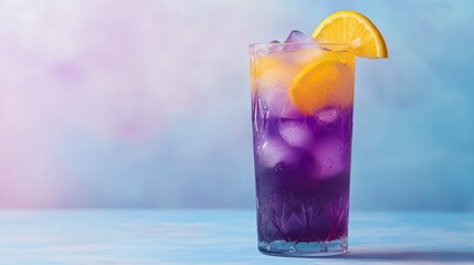 A vibrant purple cocktail with ice and a slice of orange, set against a soft blue background, evoking a refreshing summer vibe.
