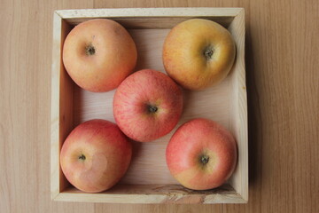 apples in a wooden bowl