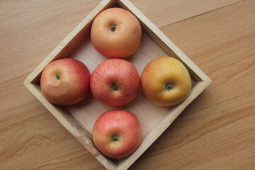 apples on wooden table