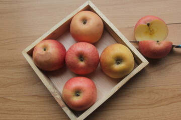 apples on a wooden table