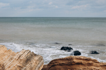 Early morning sunrise over the sea . Some clouds.