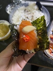 Pickled salmon with Japanese rice, seaweed, seafood dipping sauce.