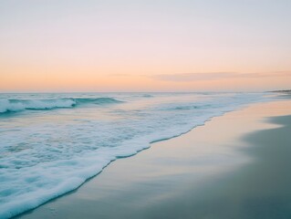 Tranquil beach scene at sunset with soft, pastel colors.
