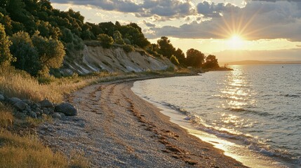 Serene Beach at Sunset with Calm Waves and Golden Sunlight