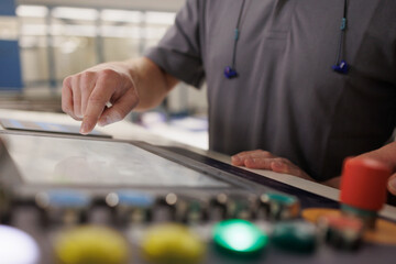 Industry Worker midsection with hand on screen